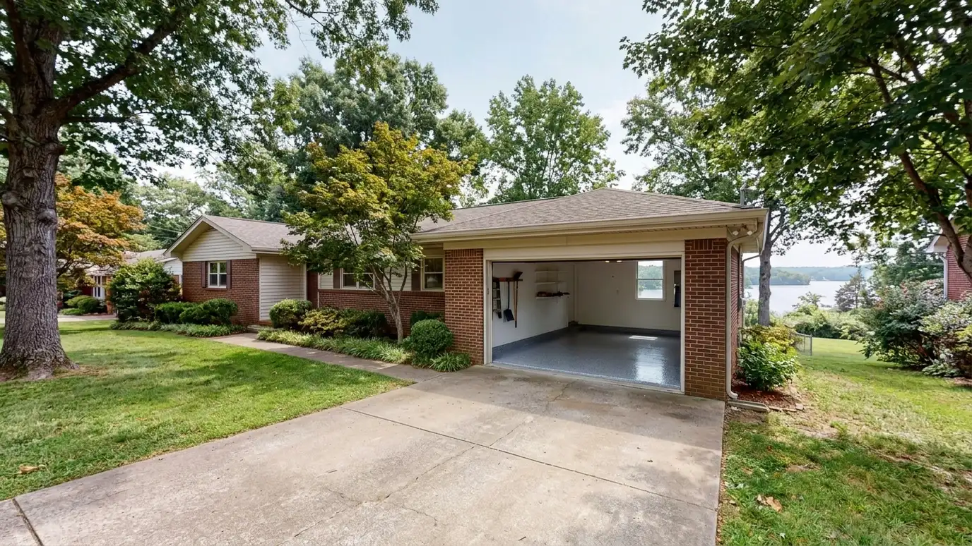 A Donelson, Tennessee home with the garage door open showing a glossy coated flake floor inside